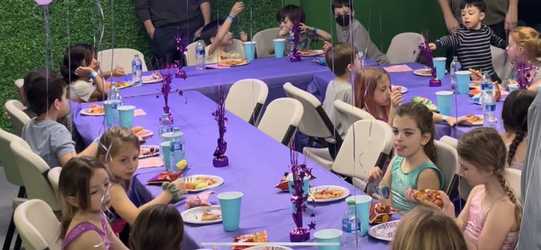 Birthday Party - kids at purple table having food