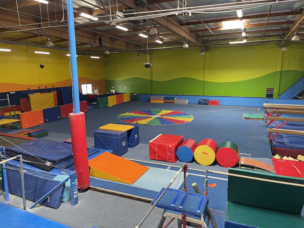 Gymnastics Facility with gymnastics equipment Colorful Mats