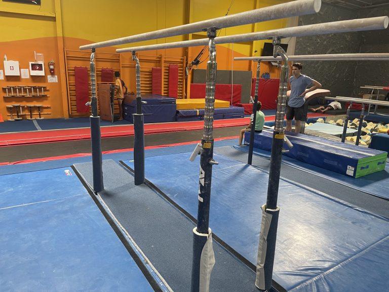 Gymnastics Facility with gymnastics equipment Colorful Mats - Parallel Bars area