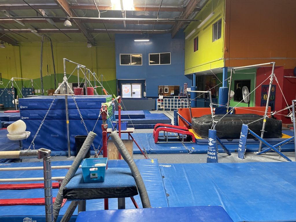 Gymnastics Facility with gymnastics equipment Colorful Mats - Uneven Bars Area