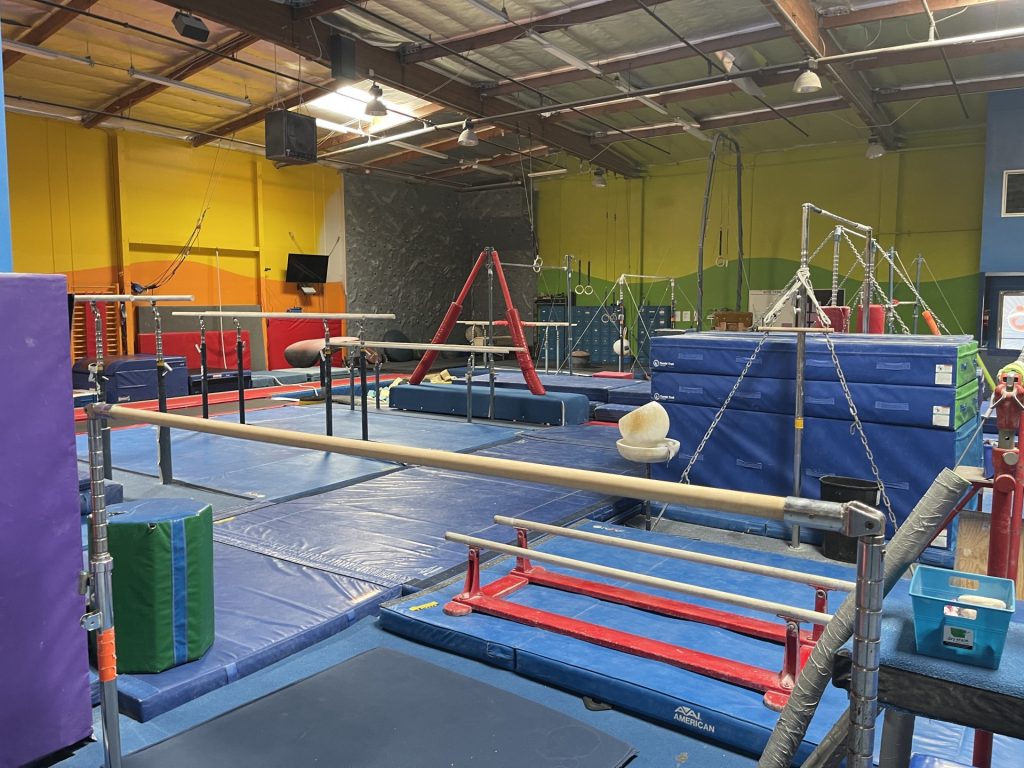 Gymnastics Facility with gymnastics equipment Colorful Mats - Bars Area