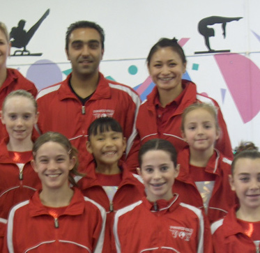 Gymnastics Team wearing red uniforms